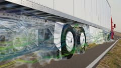 Computer rendering showing airflow around a trailer’s tandem wheels equipped with FlowBelow AeroSlider fairings and wheel covers.