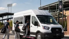 College students boarding a Master's Transportation Bus