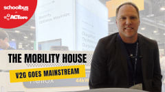 Russell Vare of The Mobility House sits at the company’s ACT Expo booth discussing vehicle-to-grid technology and smart EV charging for school bus fleets. Overlay text reads “V2G Goes Mainstream” alongside School Bus Fleet at ACT Expo branding.