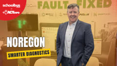 A Noregon representative stands at the company’s ACT Expo booth promoting smarter vehicle diagnostics, telematics integration, and maintenance tools for commercial and school bus fleets.