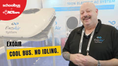 Jeff Weiss of ExoAir Systems stands beside a roof-mounted electric air conditioning unit at ACT Expo. Text overlay reads “ExoAir: Cool Bus. No Idling.” 