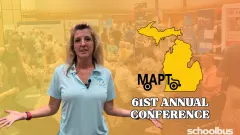 Thumbnail for a School Bus Fleet video featuring MAPT Executive Director Katrina Morris standing with her arms open in front of a blurred trade show floor at the 61st Annual Michigan Association for Pupil Transportation (MAPT) Conference. A yellow outline of the state of Michigan and the text "MAPT 61st Annual Conference" appear beside her, with the School Bus Fleet logo in the lower-right corner.