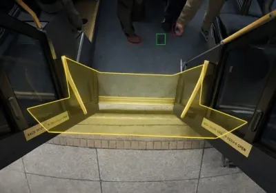An image of a doorway on a public transit vehicle with a yellow outline overlay.