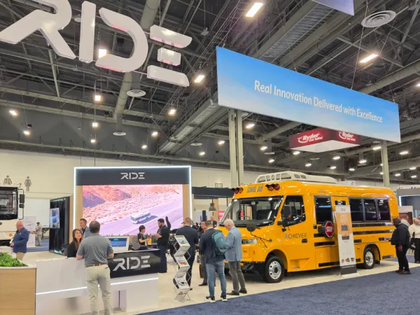 The RIDE booth features the company’s Achiever electric school bus and commercial vehicle lineup on the ACT Expo show floor.