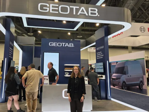 Charlotte Argue poses at the Geotab booth highlighting connected fleet management and telematics solutions at ACT Expo 2026.