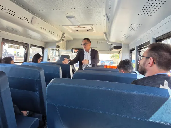 Attendees participate in a RIDE electric school bus demonstration during the ACT Expo ride-and-drive event.