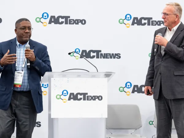 Steve Whaley of Blue Bird and Anthony Jackson of Bibb County School District speak during an ACT Expo session on managing mixed-energy school bus fleets.