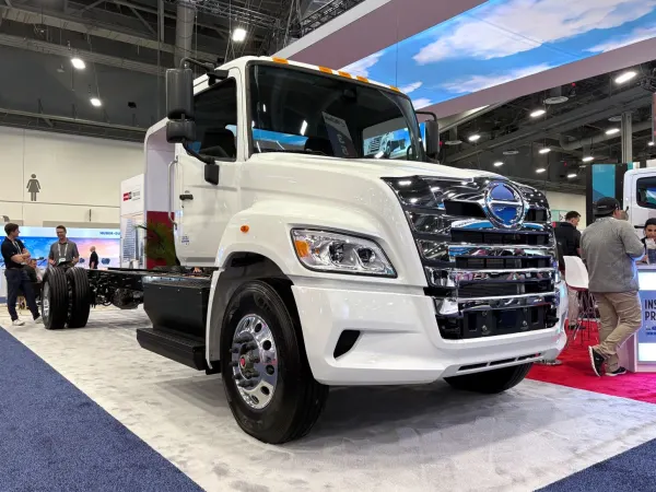 White electric Hino truck on show floor