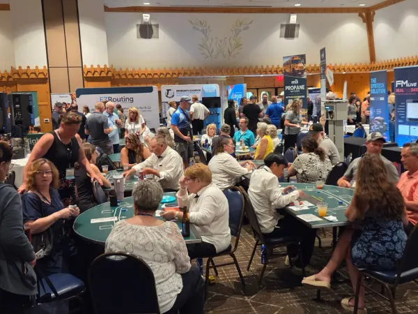Attendees play casino games and visit exhibitor booths during the MAPT trade show, which combines vendor networking with a casino-themed evening event.