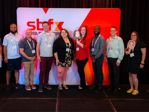 Nine School Bus Fleet 2026 Trailblazers and representatives pose together onstage during the awards ceremony at School Bus Fleet ConneX.