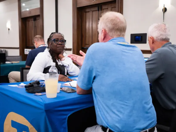 Transportant representatives meet with Donna Cox during a one-on-one meeting at School Bus Fleet ConneX.