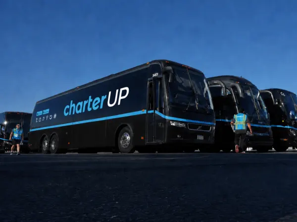 CharterUP motorcoaches stand staged for World Cup service.