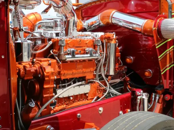 Classic truck with hood open to display engine with chrome accents