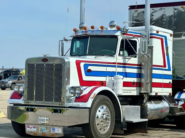 Classic Peterbilt truck with red, white, and blue color scheme
