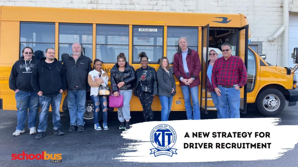 a group of people stands in front of a school bus
