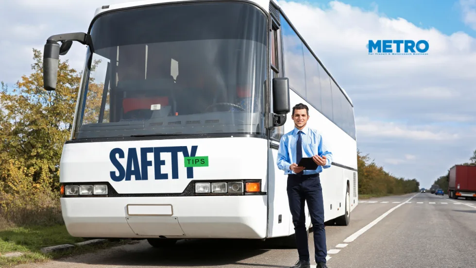 Bus driver standing in front of a bus