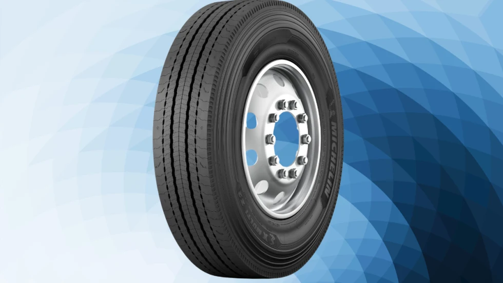 Side view of the Michelin X Multi Z2 regional all-position truck tire mounted on a silver wheel, shown against a blue geometric background.