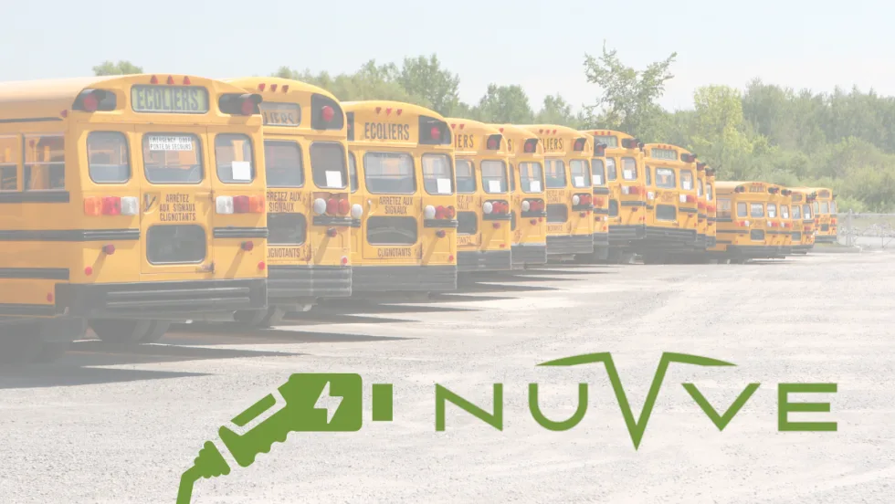 Row of yellow school buses parked in a lot with the Nuvve logo and an electric charging icon overlaid in the foreground.