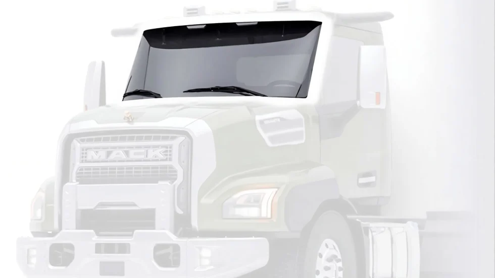 Front view of a Mack Granite heavy-duty truck featuring the new ImpactShield windshield with Corning Fusion5 Glass technology.
