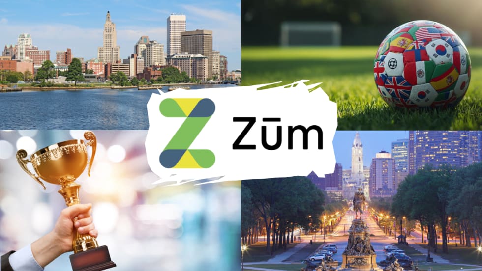 Collage graphic featuring the Zūm logo surrounded by images representing the company's recent milestones: the Providence, Rhode Island skyline; a soccer ball decorated with international flags symbolizing FIFA World Cup 2026 transportation services; a trophy representing CEO Ritu Narayan's Entrepreneur Of The Year award; and the Philadelphia skyline.