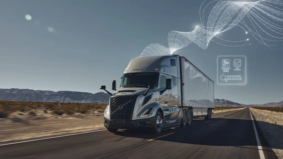 Photo of Volvo VNL truck on highway with illustration of software over the air updates
