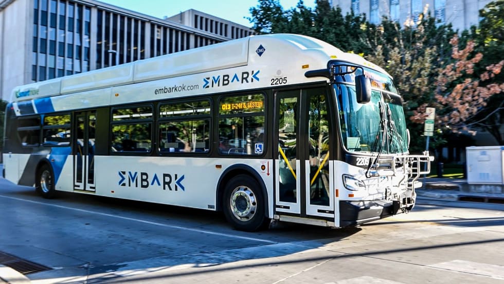 An EMBARK bus going down the street.
