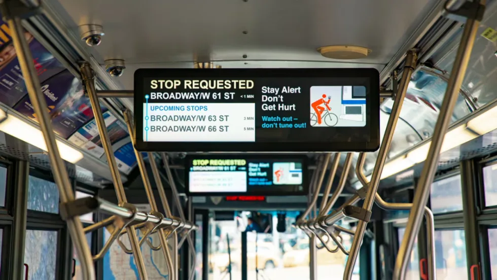 A Hitachi Rail screen on public transit.