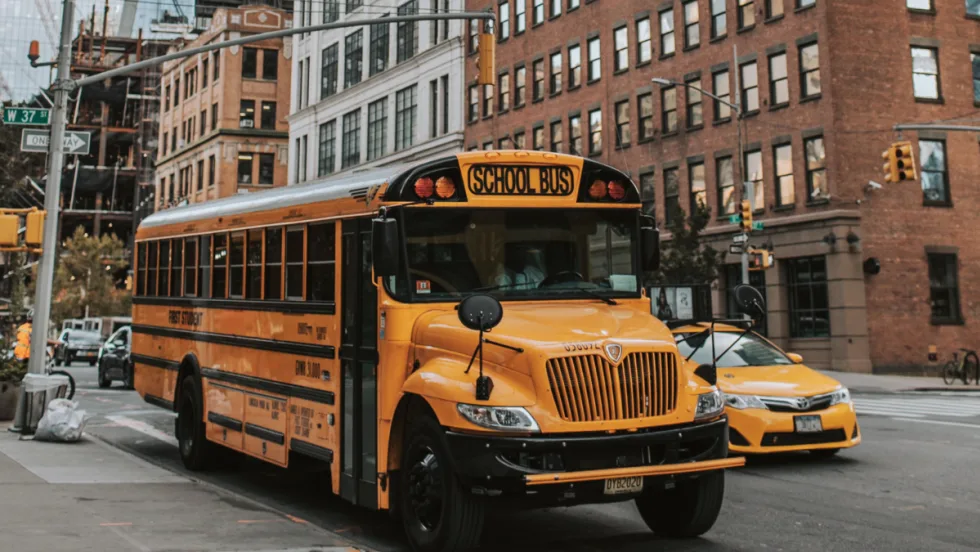 A New York school bus in the street.