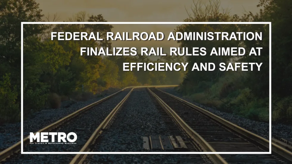 An image of empty railroad tracks in Minnesota with white text reading "Federal Railroad Administration Finalizes Rail Rules Aimed at Efficiency and Safety."