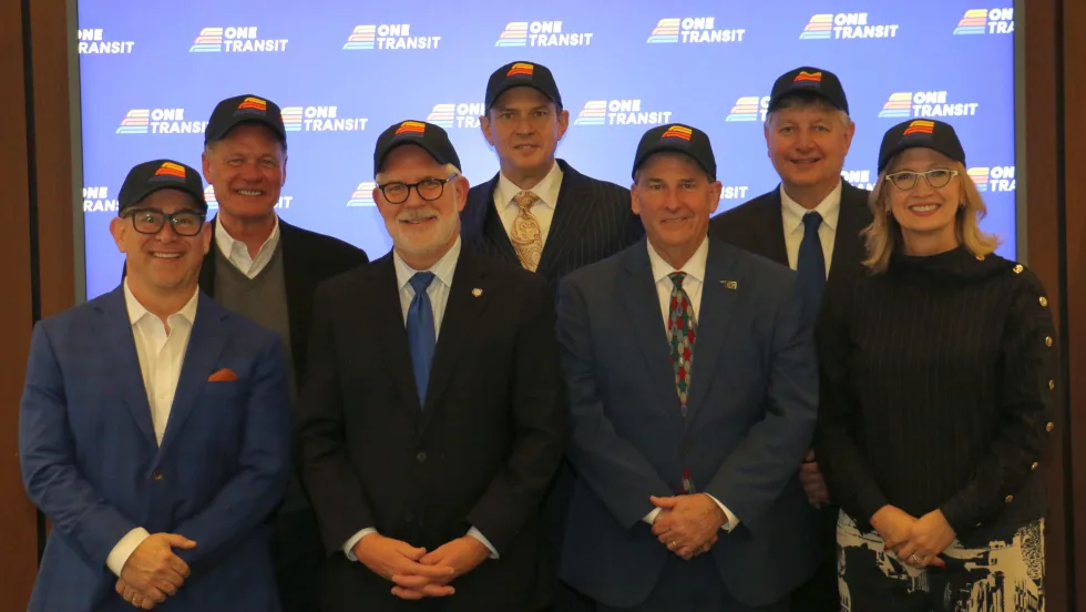 The ONE Transit Board wearing newly branded hats.