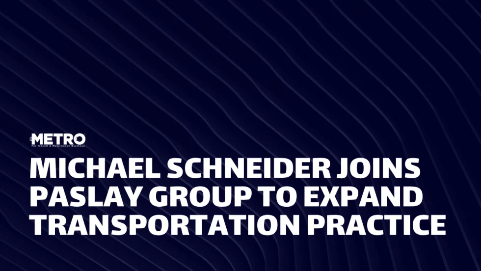 A blue and white graphic with text reading "Michael Schneider Joins Paslay Group to Expand Transportation Practice."