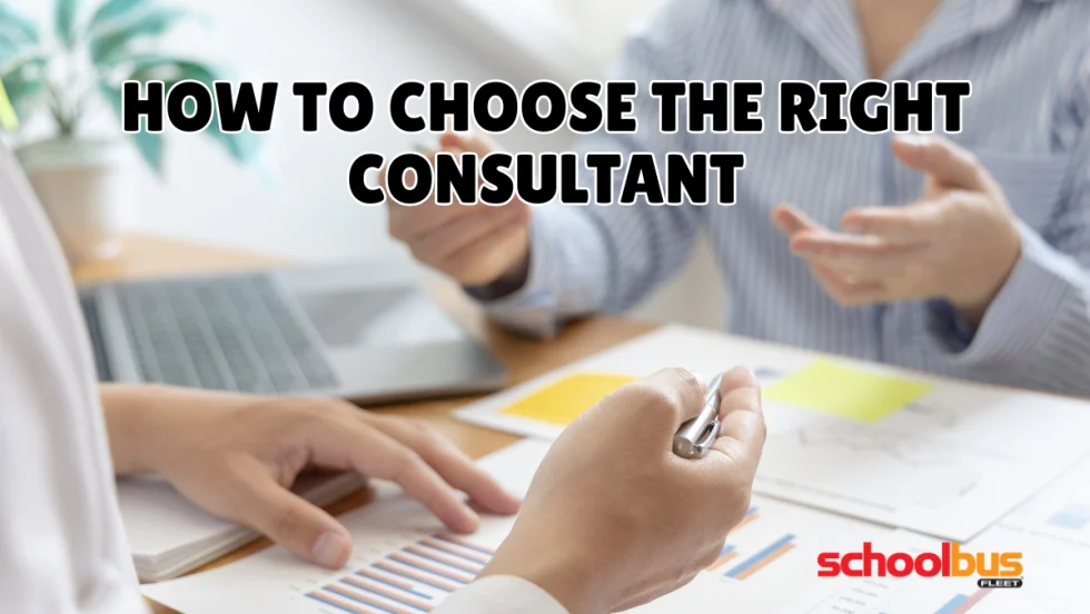 Two professionals discuss charts and documents at a desk, with the headline “How to Choose the Right Consultant” and the School Bus Fleet logo.