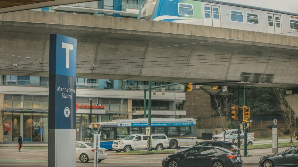 A TransLink bus and rail line in operation. 