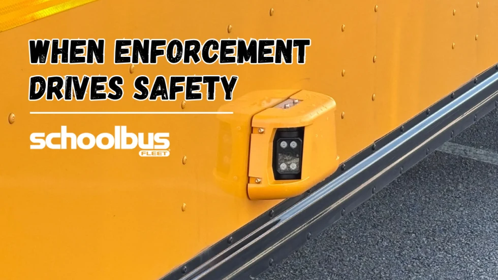 Close-up of a stop-arm enforcement camera mounted on a yellow school bus, with the headline “When Enforcement Drives Safety” and the School Bus Fleet logo.