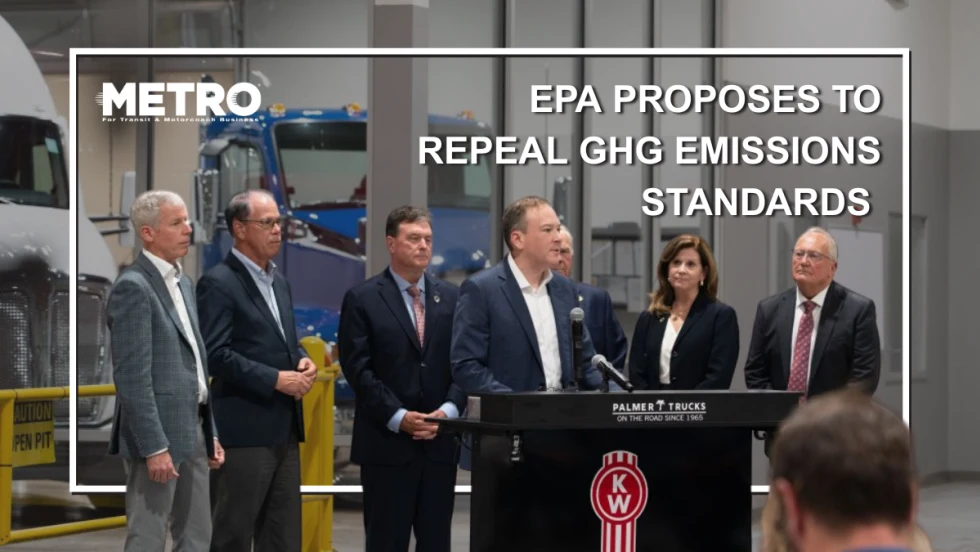 Officials in formal attire stand around a podium.