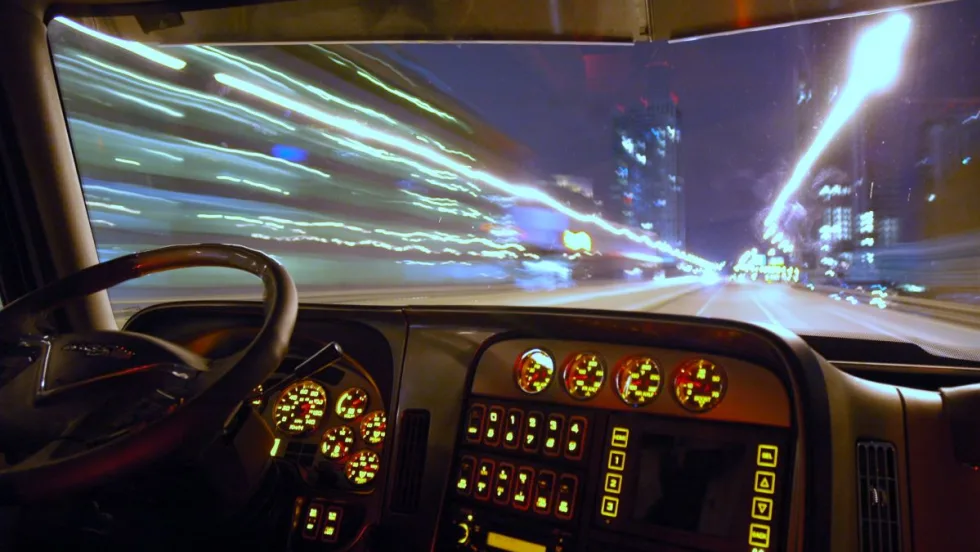 Blurry truck driver at night. 