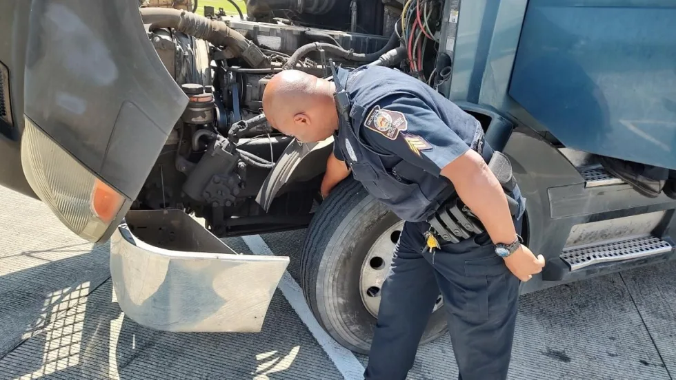 Commercial vehicle inspector at weigh station