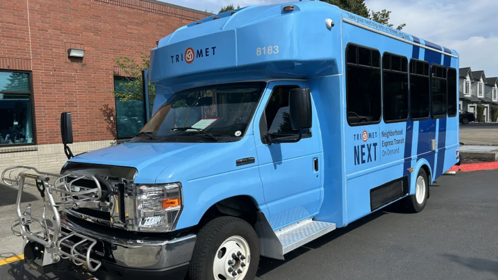 A blue TriMet NEXT bus.