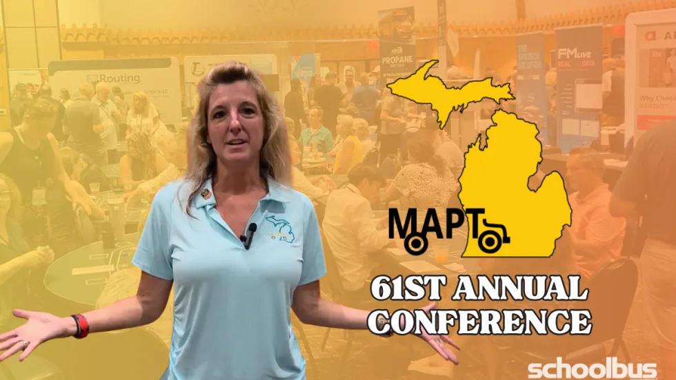 Thumbnail for a School Bus Fleet video featuring MAPT Executive Director Katrina Morris standing with her arms open in front of a blurred trade show floor at the 61st Annual Michigan Association for Pupil Transportation (MAPT) Conference. A yellow outline of the state of Michigan and the text "MAPT 61st Annual Conference" appear beside her, with the School Bus Fleet logo in the lower-right corner.