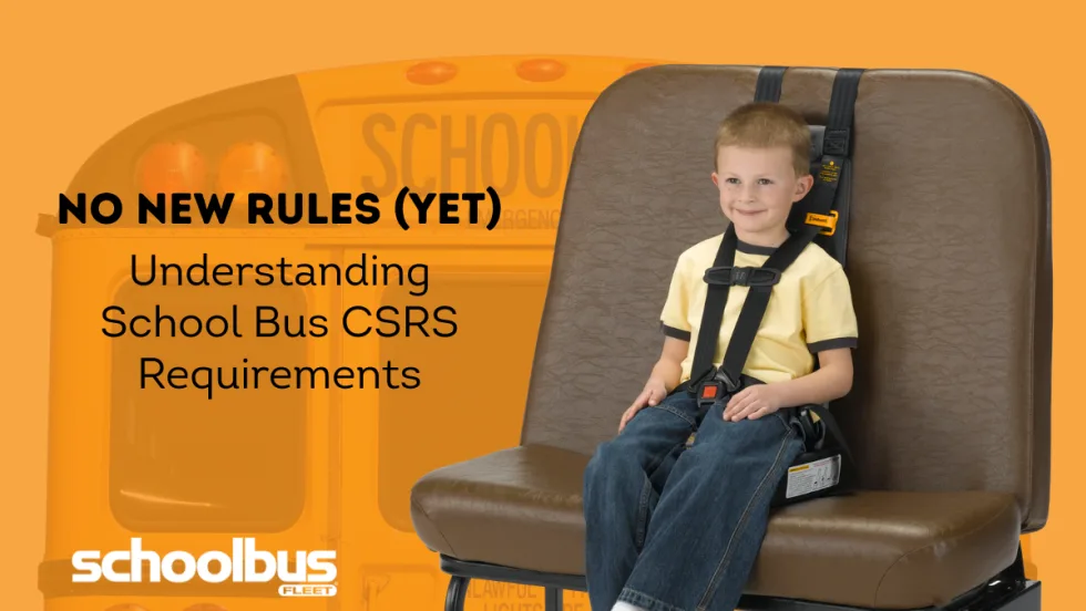 Young child secured in a child restraint system on a school bus seat, highlighting school bus CSRS requirements.