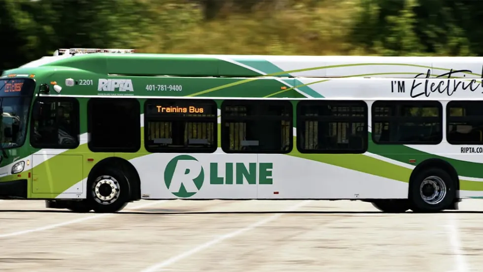A green and white Rhode Island Public Transit Authority electric bus.