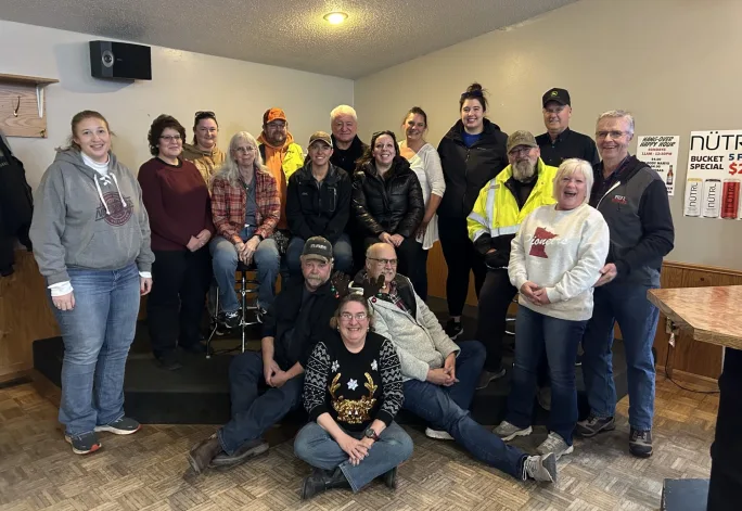 A group of people pose for a photo.