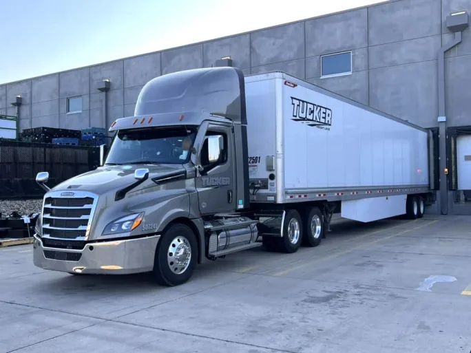 Tucker Freight Lines dry van backed into a loading dock