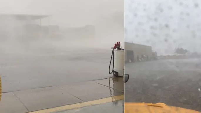 Heavy monsoon rain and low visibility at a bus yard with standing water, showing dangerous driving conditions and flooding that disrupted school transportation routes