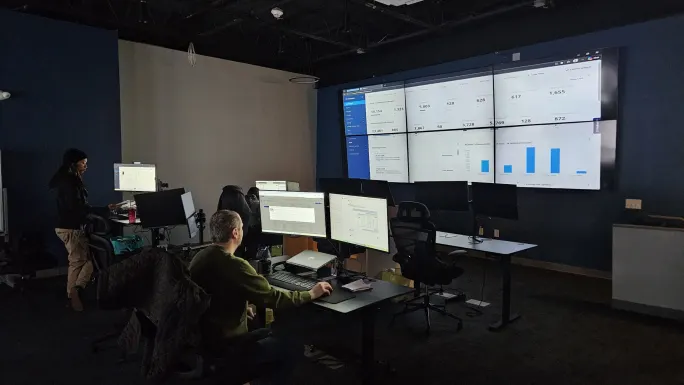 InCharge Energy employees working on the new service management platform.