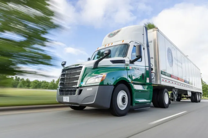 Green ODFL tractor trailer on highway