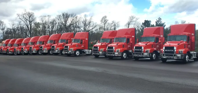 Line of red Mack trucks