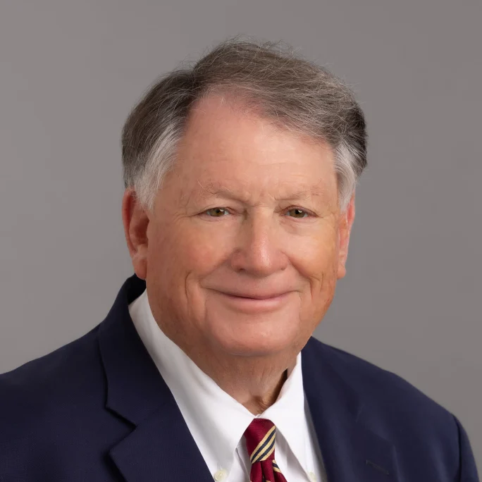 Business portrait of Michael Schneider on a gray background.