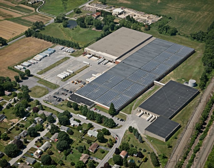 Solar panels on top of a warehouse roof