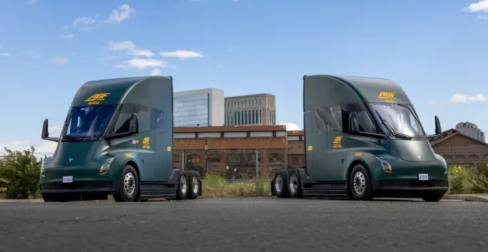 Two Tesla Semi electric heavy duty trucks with ABF branding